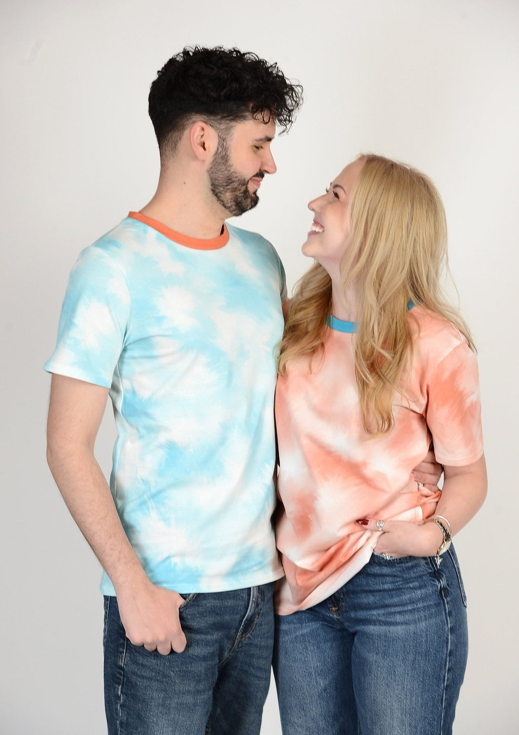 couple wearing matching tie-dye t‑shirt pair Rumble